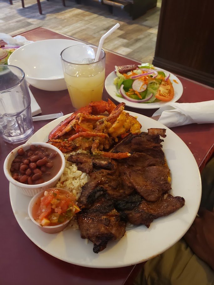 Colorful Salvadoran plates on a simple restaurant table.