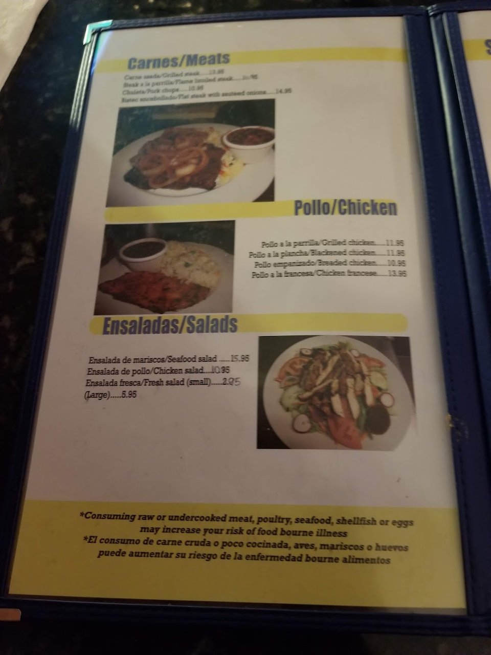 Menu page with seafood dishes and Salvadoran favorites.